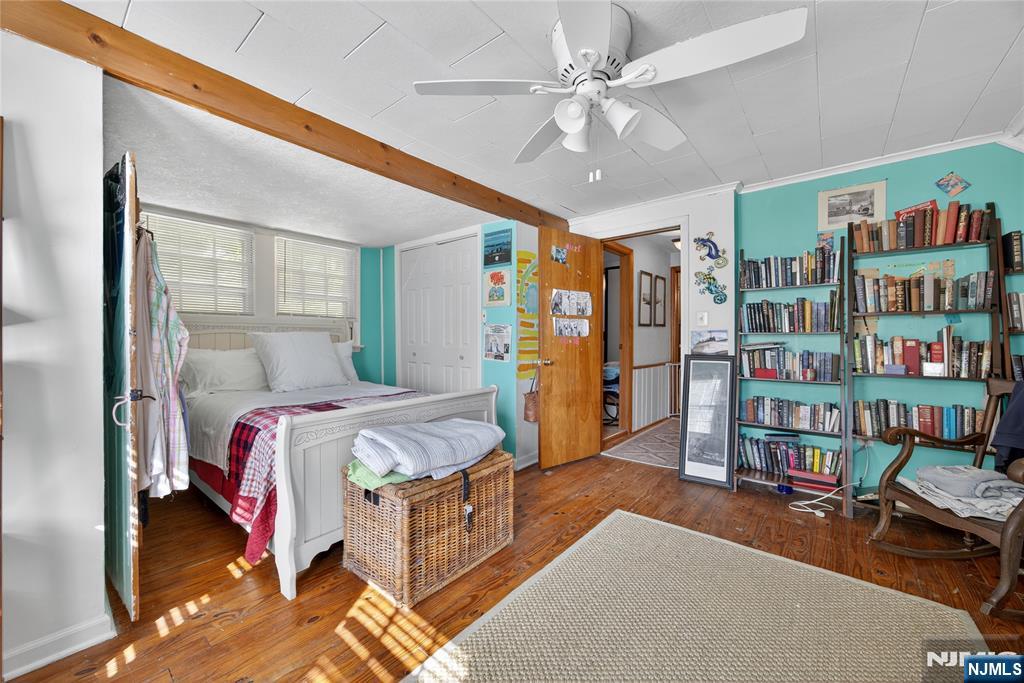 370 Goffle Road Hawthorne, NJ 07506 - Photo 23 of 37 a bedroom with bed and a large window