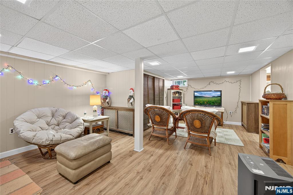 370 Goffle Road Hawthorne, NJ 07506 - Photo 26 of 37 a living room with furniture and a flat screen tv