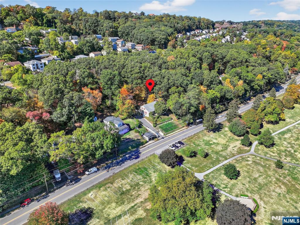 370 Goffle Road Hawthorne, NJ 07506 - Photo 36 of 37 an aerial view of green landscape with trees houses and mountain view