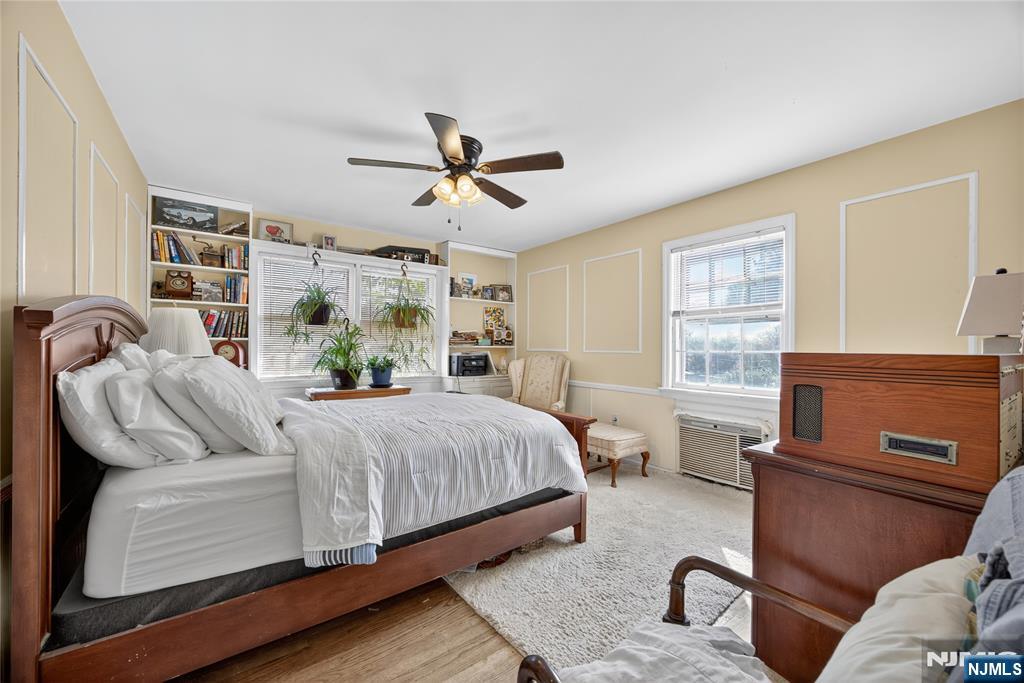 370 Goffle Road Hawthorne, NJ 07506 - Photo 6 of 37 a bedroom with a bed and wooden floor