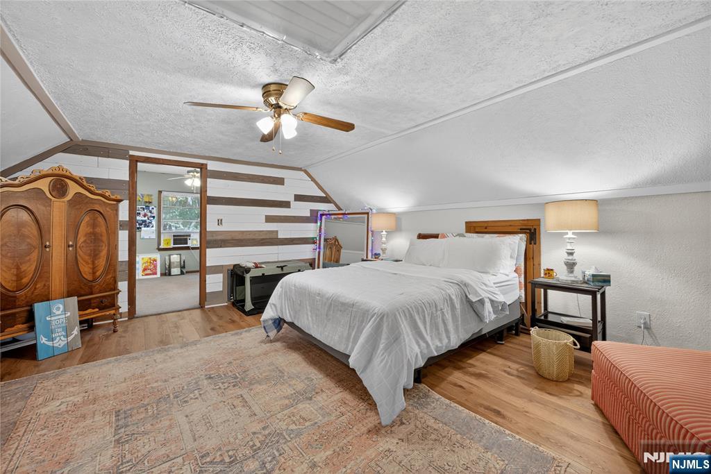 370 Goffle Road Hawthorne, NJ 07506 - Photo 7 of 37 a bedroom with a bed and walk in closet