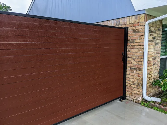 a bedroom with a large bed and a chair