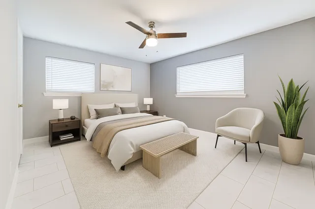 a bedroom with a bed and chair