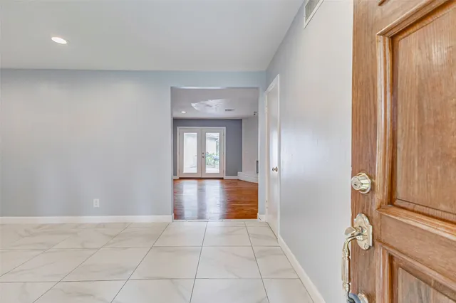 a view of a livingroom with a fireplace and a potted plant