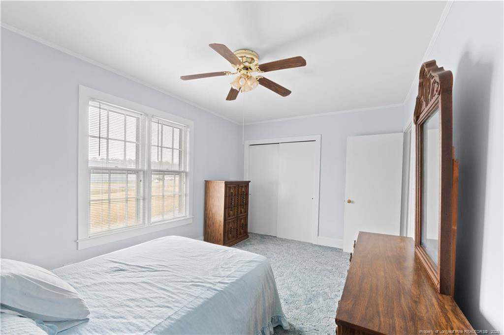 6131 Stewart Road Godwin, NC 28344 - Photo 24 of 27 a bedroom with a bed and a window