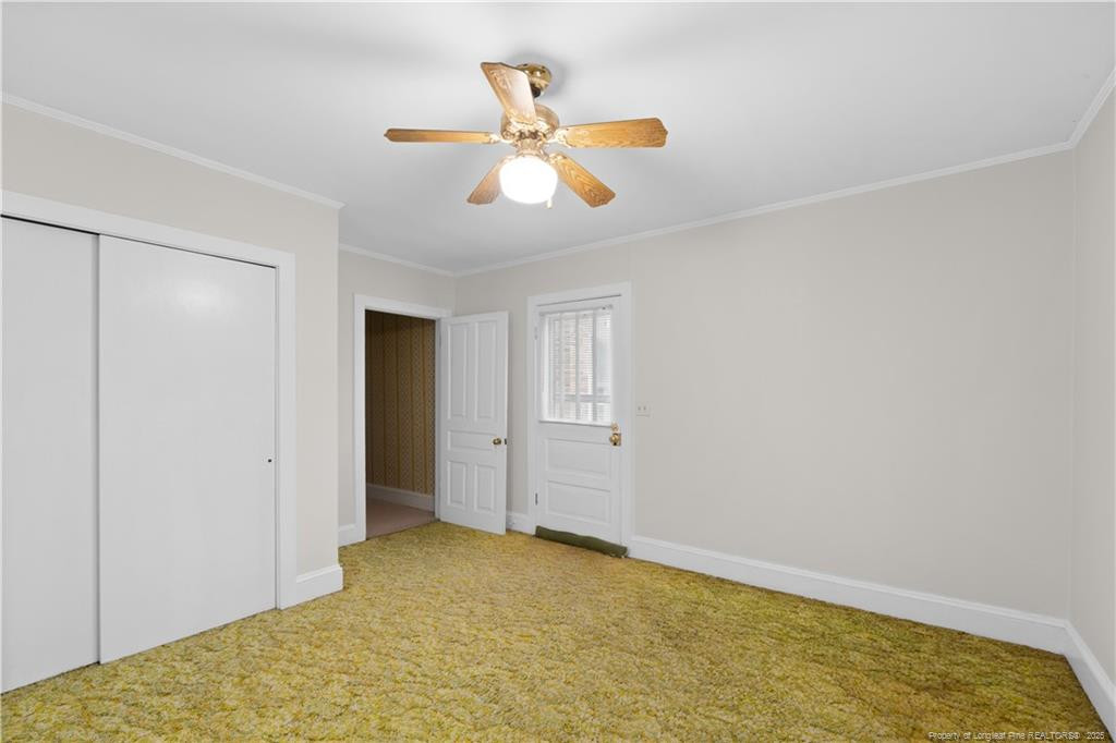 6131 Stewart Road Godwin, NC 28344 - Photo 26 of 27 a view of a livingroom with a ceiling fan and window
