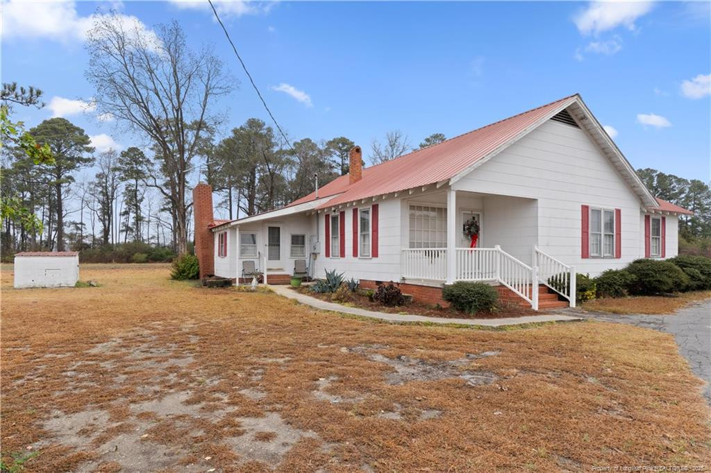 6131 Stewart Road Godwin, NC 28344 - Photo 3 of 27 a front view of a house with a yard