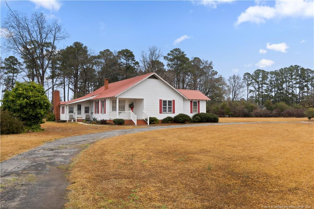 6131 Stewart Road Godwin, NC 28344 - Photo 4 of 27 a front view of a house with a yard