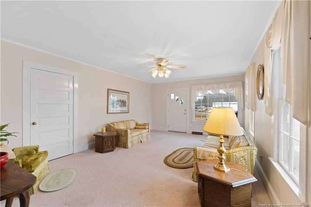 6131 Stewart Road Godwin, NC 28344 - Photo 7 of 27 a living room with furniture and a table