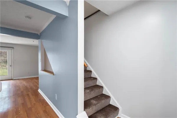 a view of entryway with wooden floor