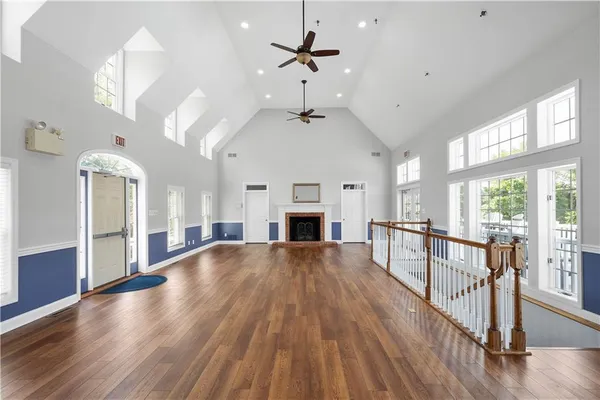 a kitchen with stainless steel appliances granite countertop wooden floors and sink