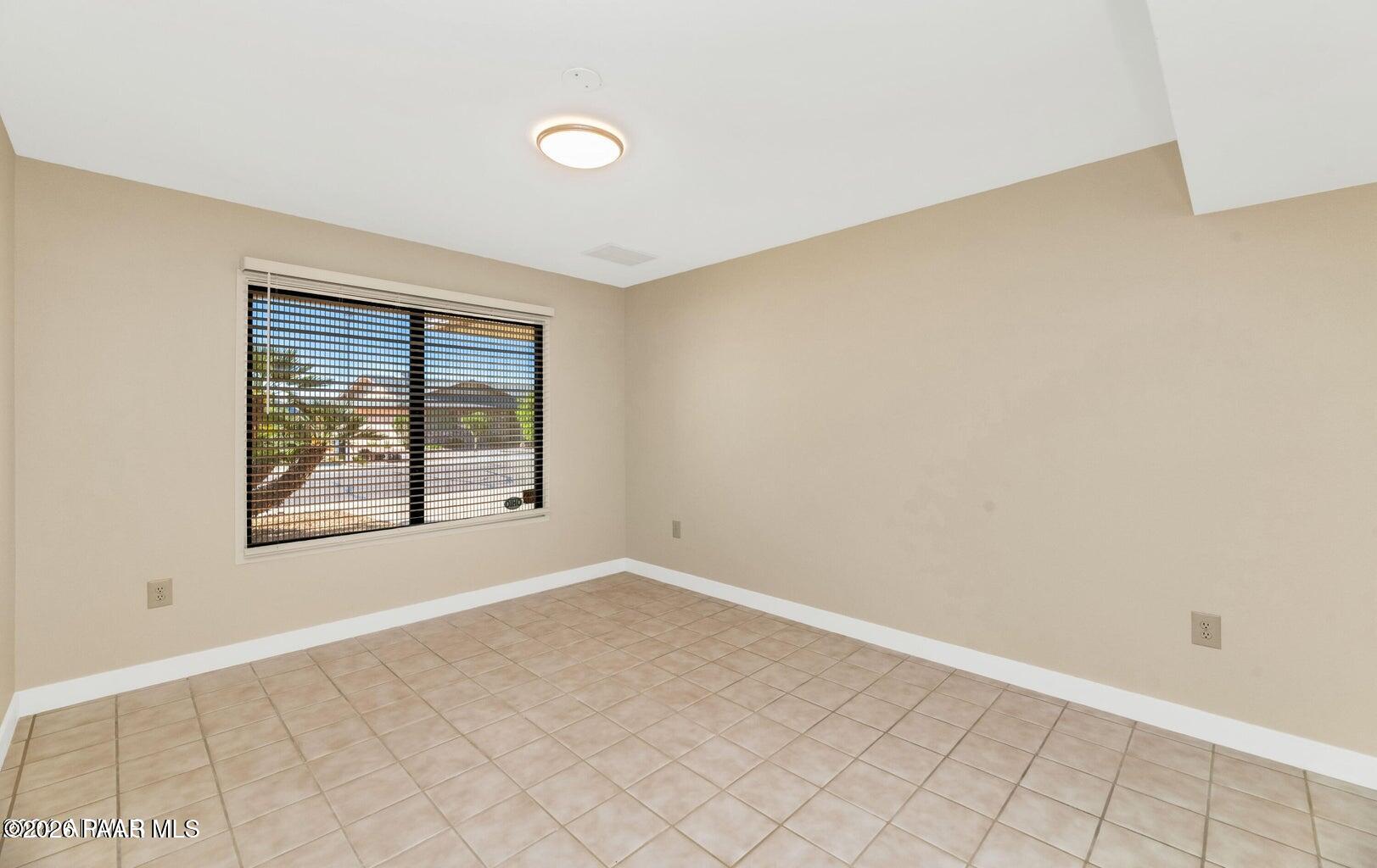 12602 West Rampart Drive Sun City, AZ 85375 - Photo 23 of 28 an empty room with windows