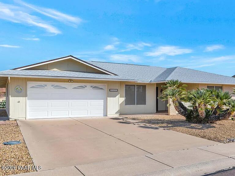 12602 West Rampart Drive Sun City, AZ 85375 - Photo 28 of 28 a front view of a house with a yard and garage