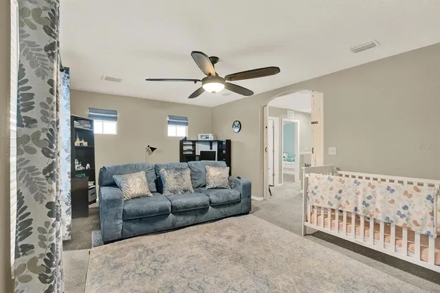 a bathroom with a sink a toilet and shower curtain