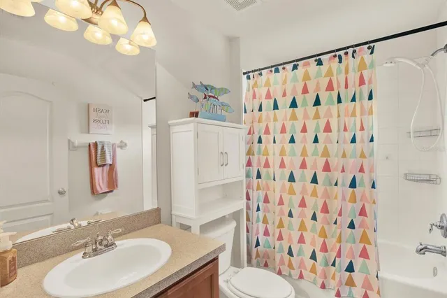 a bedroom with furniture and baby bed