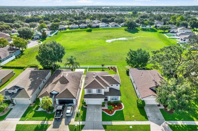 an aerial view of a house with a garden