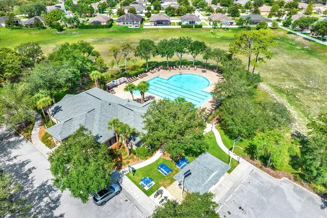 an aerial view of a house with a yard