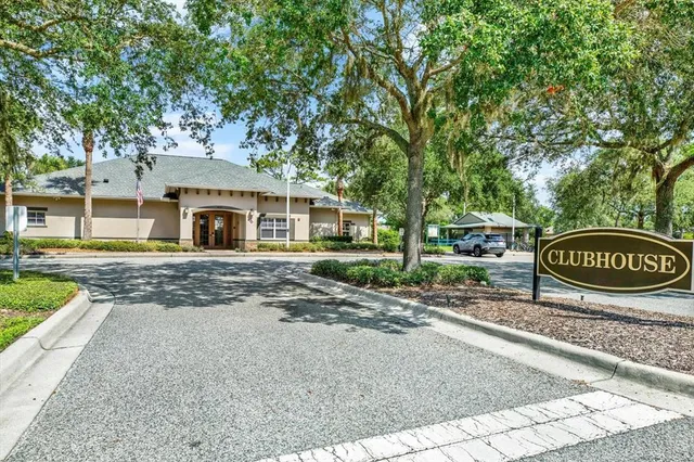 a view of swimming pool with outdoor seating and plants