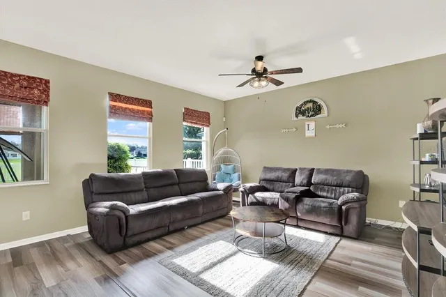 a living room with furniture and a window