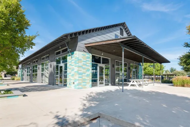 a view of a house with backyard and porch