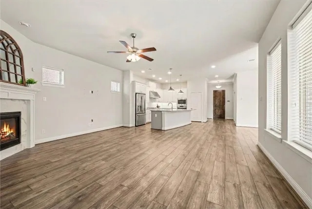a view of a kitchen with a sink and a stove top oven