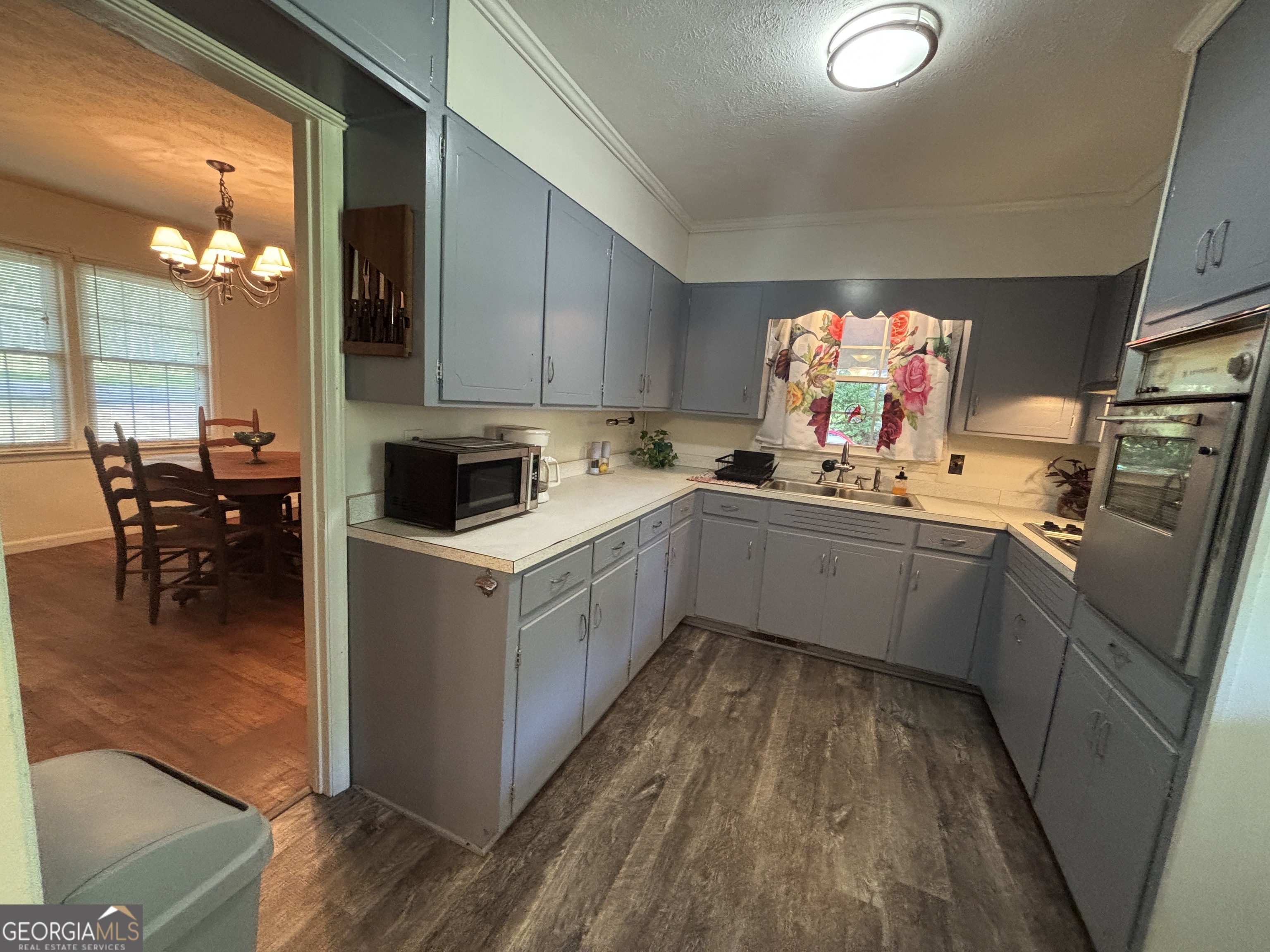 152 Crest Drive Cochran, GA 31014 - Photo 7 of 54 a kitchen with a sink stove and cabinets