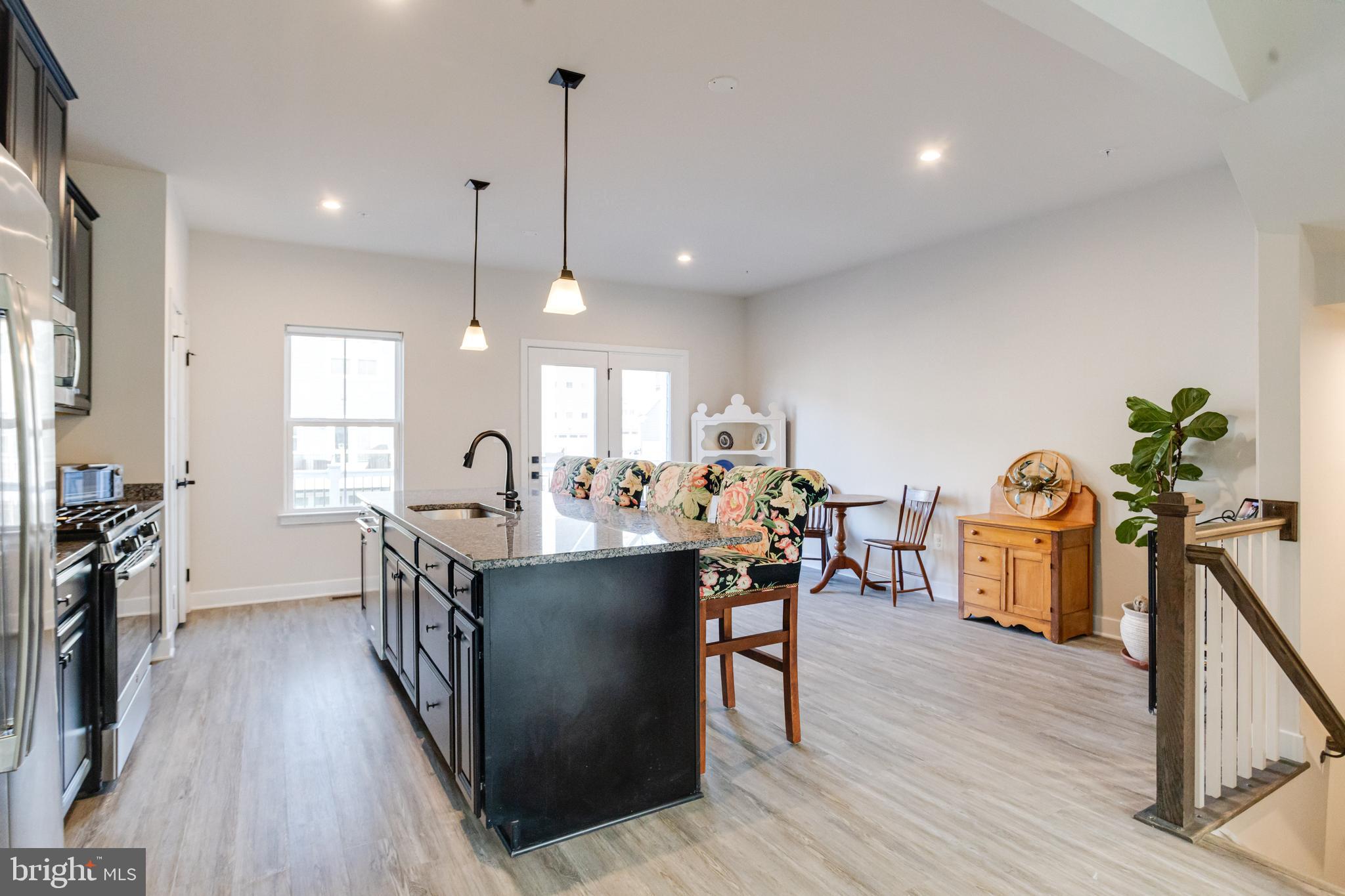 6222 Islington Street Middle River, MD 21220 - Photo 17 of 76 a view of a dining room with furniture window and wooden floor