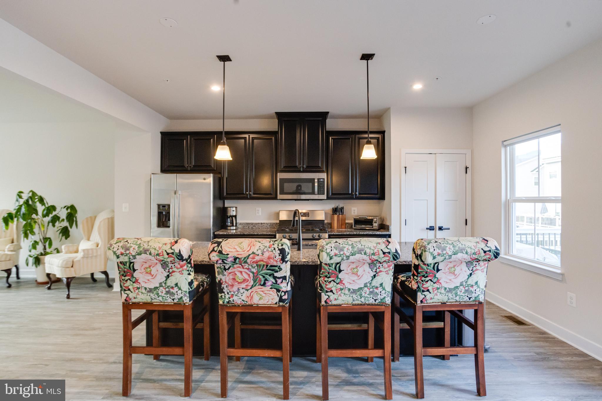 6222 Islington Street Middle River, MD 21220 - Photo 21 of 76 a view of a dining room with furniture and wooden floor