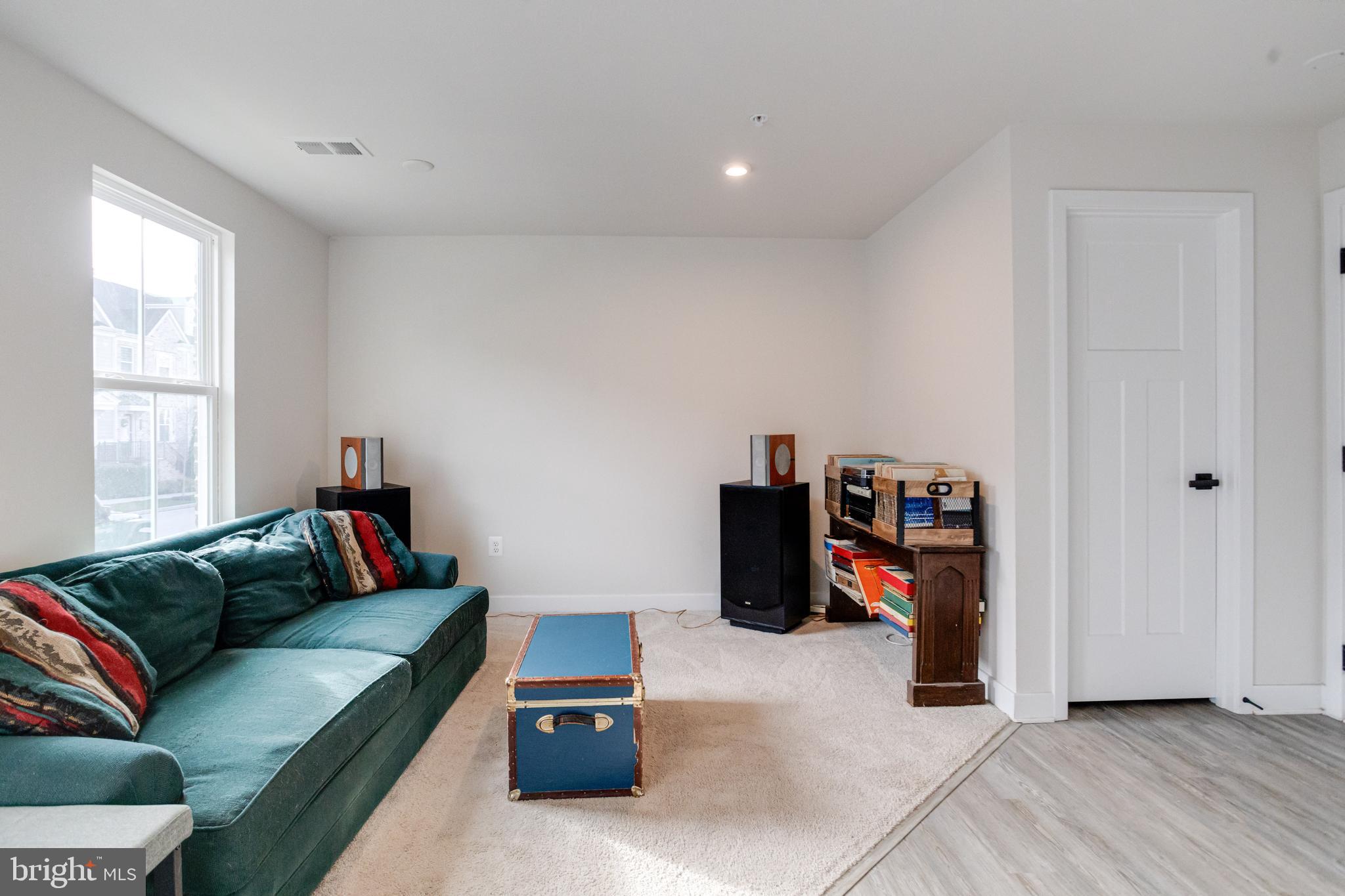 6222 Islington Street Middle River, MD 21220 - Photo 3 of 76 a living room with furniture a flat screen tv and a window