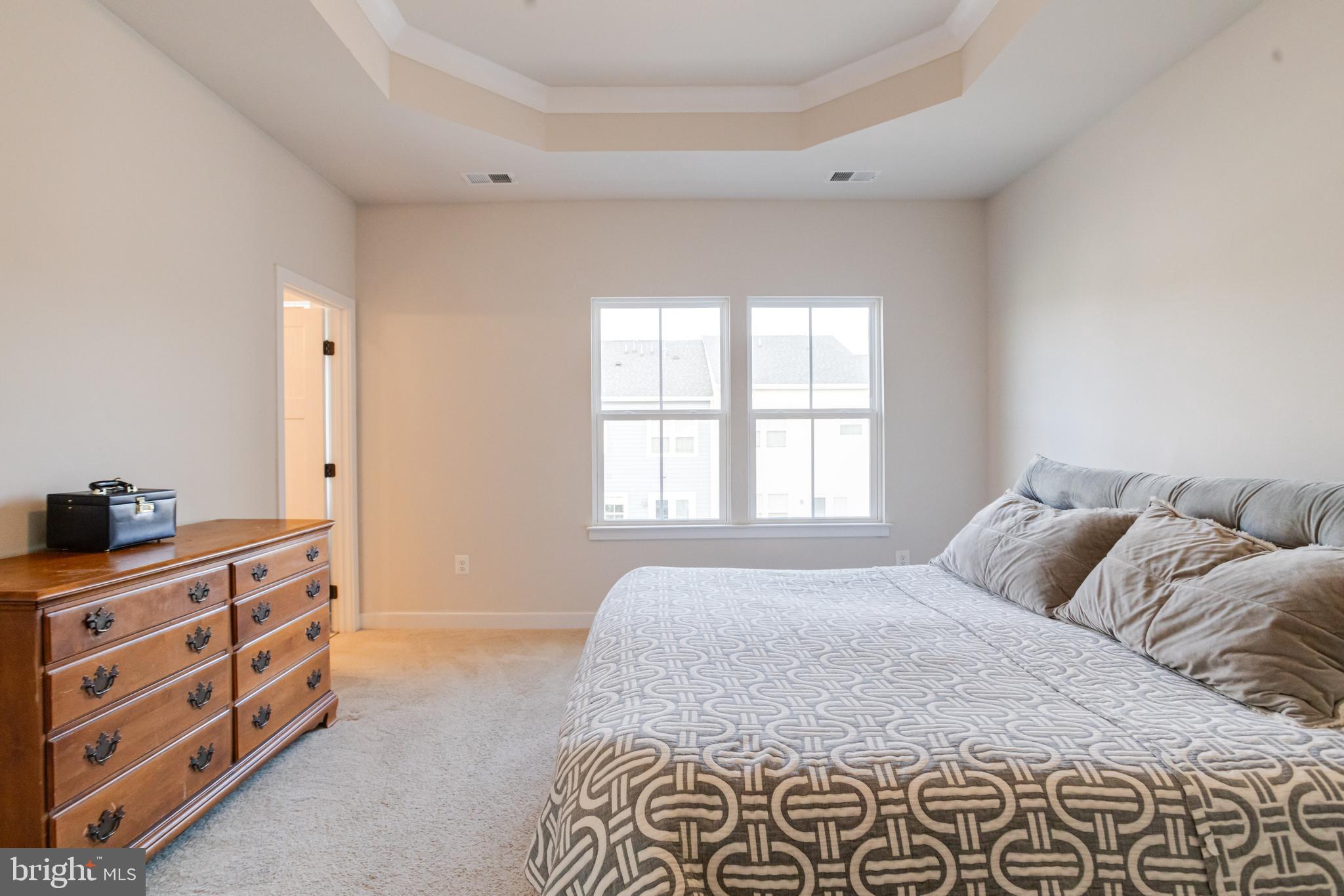 6222 Islington Street Middle River, MD 21220 - Photo 35 of 76 a bedroom with a bed and a dresser in it