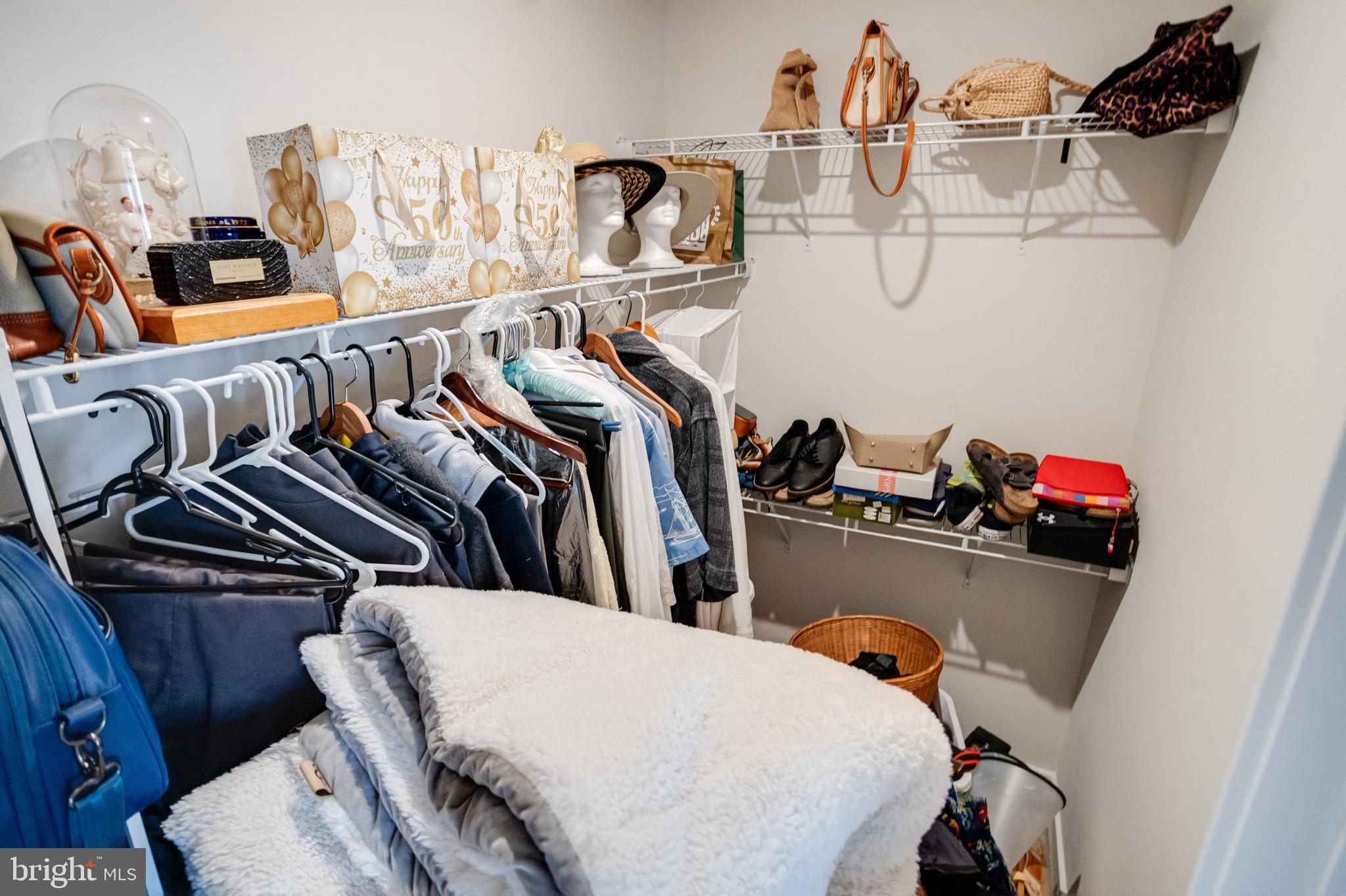 6222 Islington Street Middle River, MD 21220 - Photo 42 of 76 a view of walk in closet with clothes and shoes
