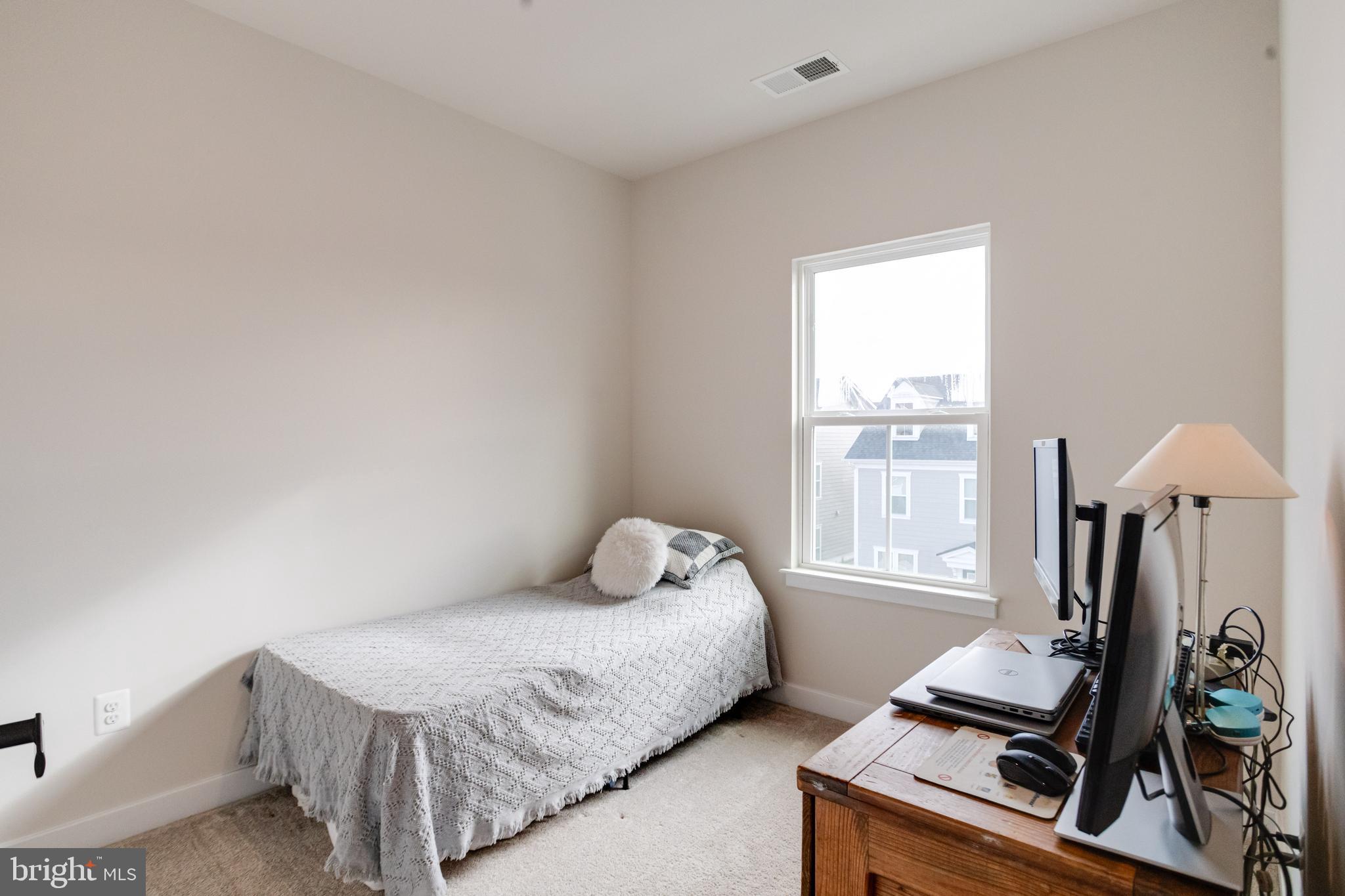 6222 Islington Street Middle River, MD 21220 - Photo 46 of 76 a bedroom with a bed and windows