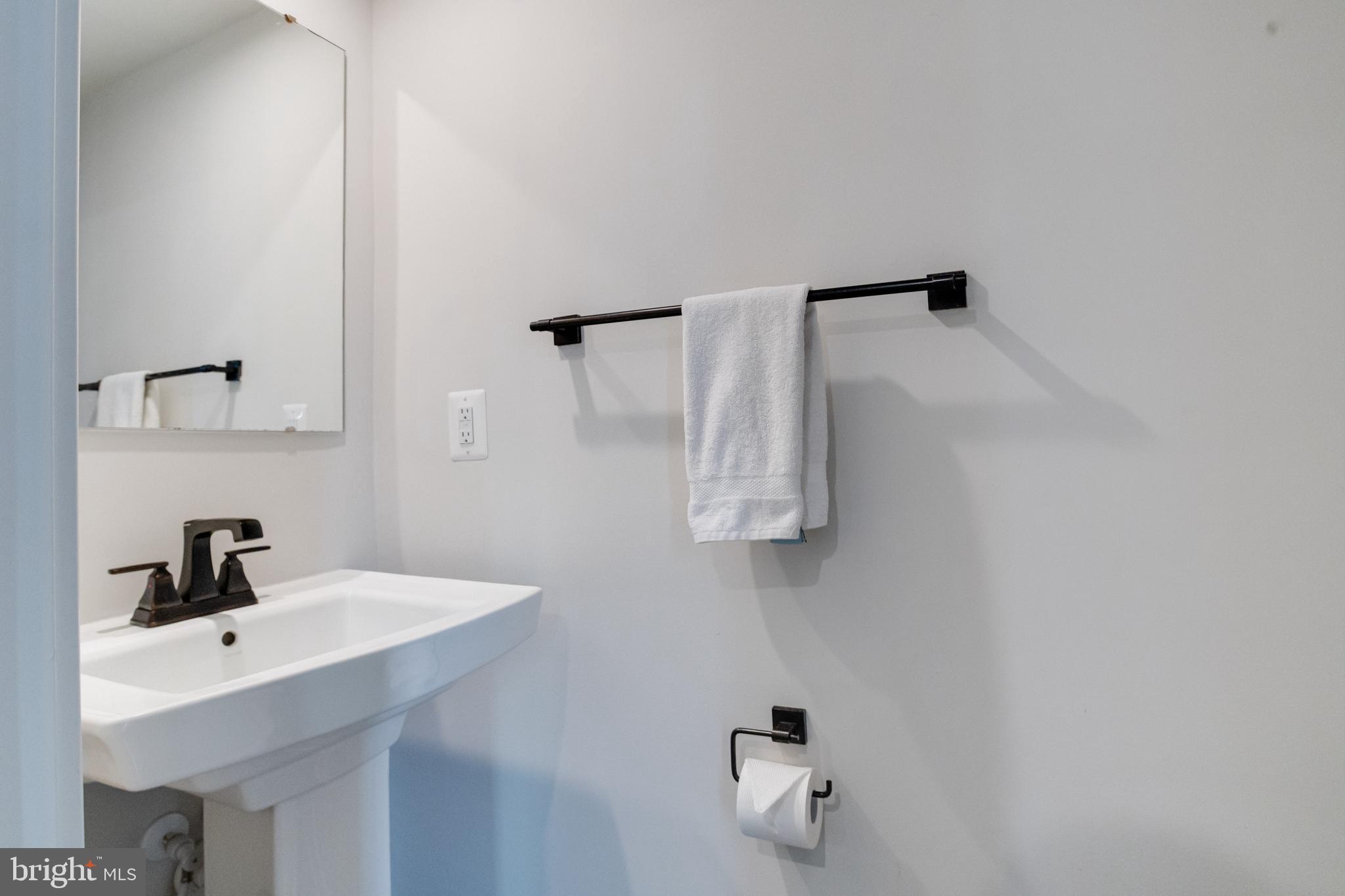 6222 Islington Street Middle River, MD 21220 - Photo 8 of 76 a bathroom with a sink and mirror