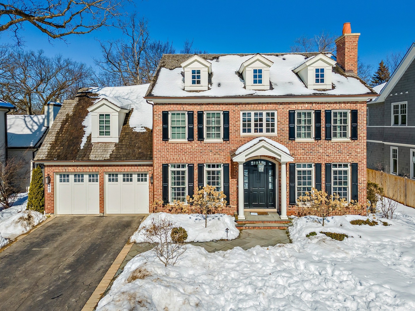 1161 Chatfield Road Winnetka, IL 60093 - Photo 1 of 42 a front view of a house with a yard
