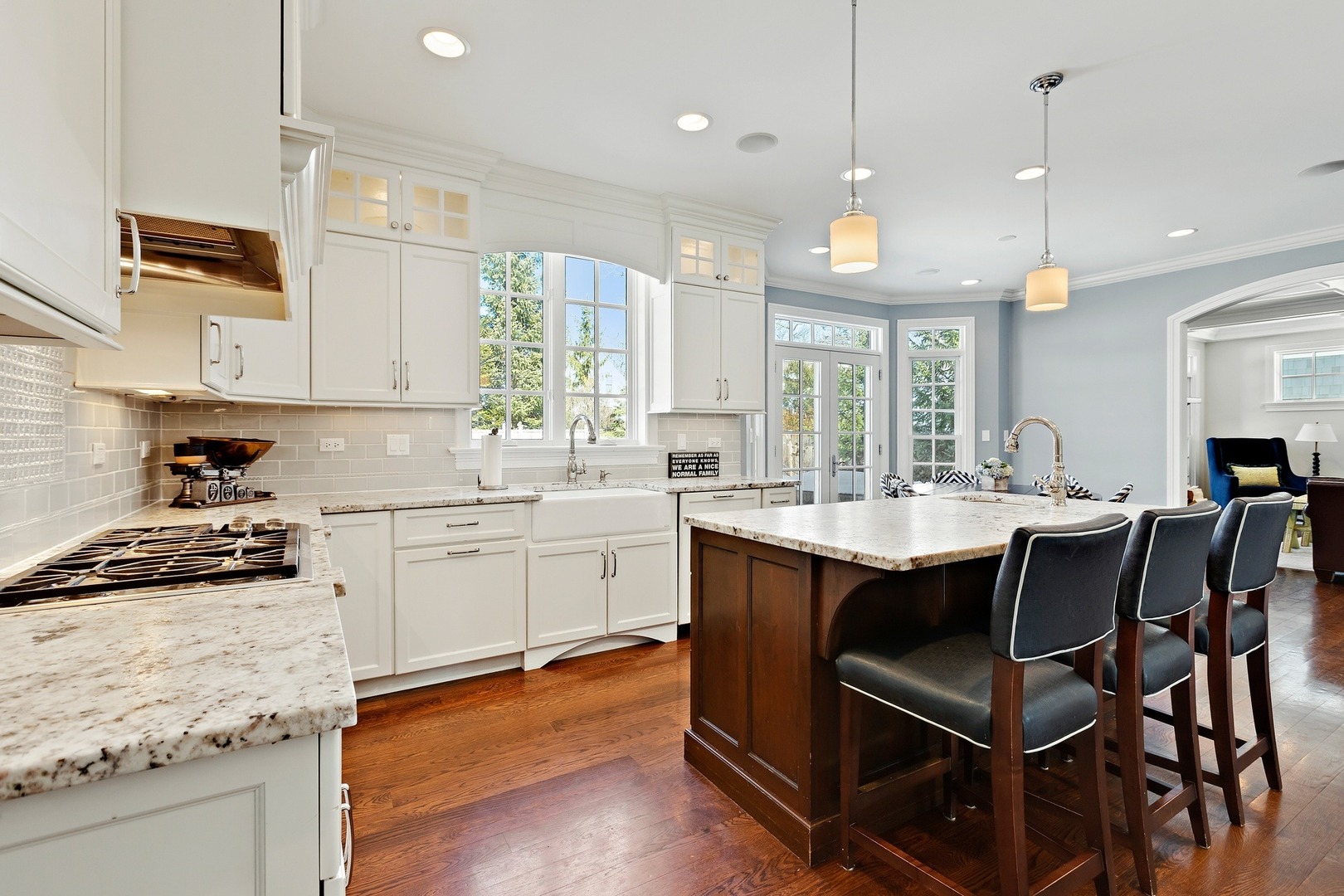 1161 Chatfield Road Winnetka, IL 60093 - Photo 12 of 42 a kitchen with a sink and wooden cabinets