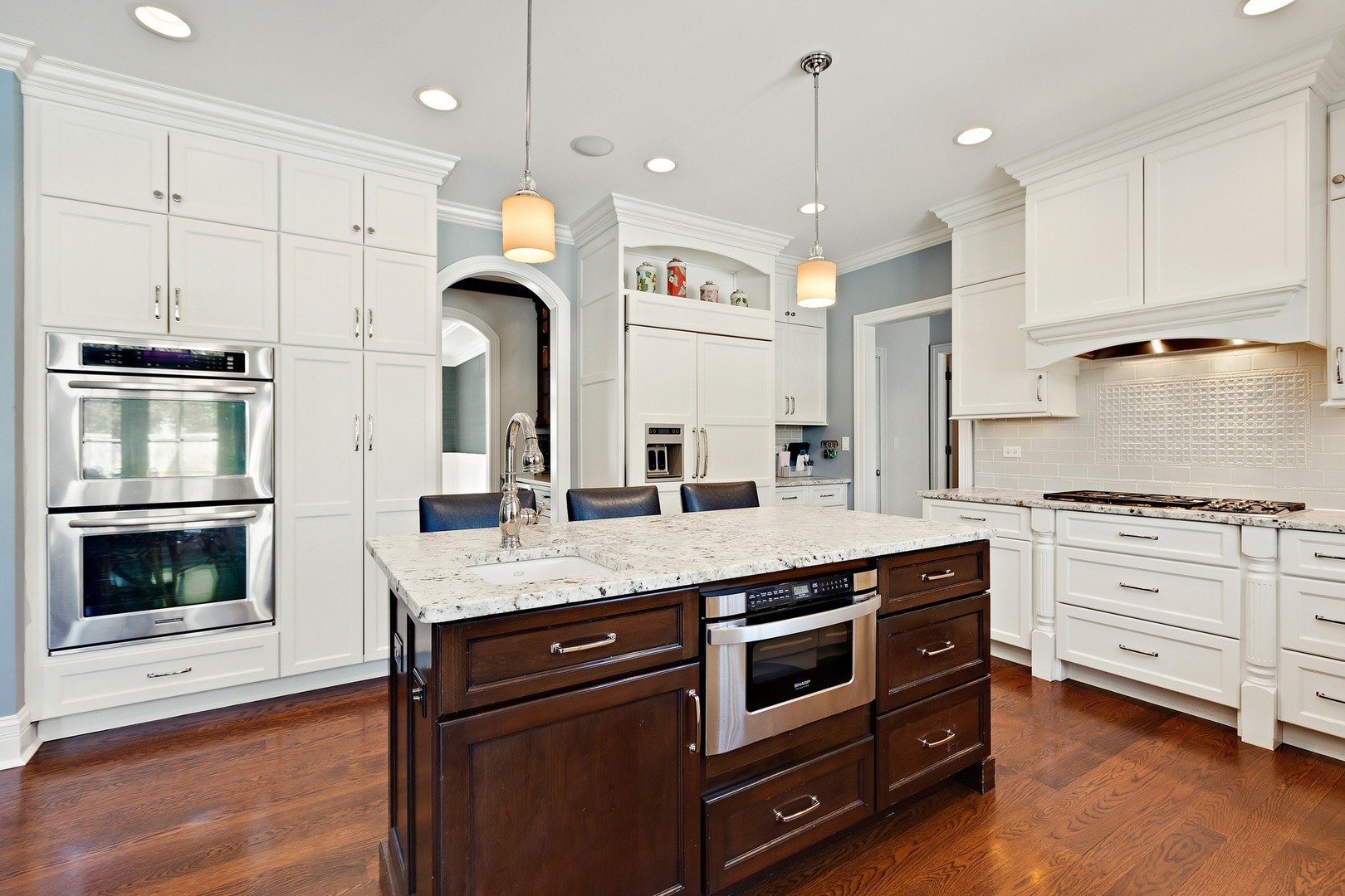 1161 Chatfield Road Winnetka, IL 60093 - Photo 13 of 42 a kitchen with stainless steel appliances granite countertop a stove and a refrigerator