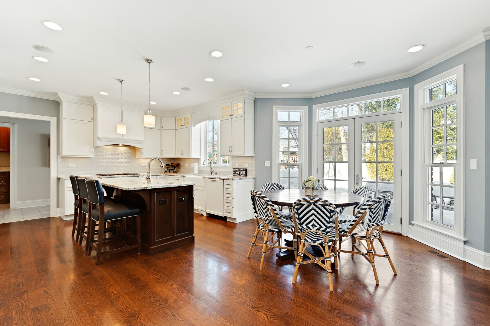 1161 Chatfield Road Winnetka, IL 60093 - Photo 15 of 42 a living room with dining table wooden floor and a large window