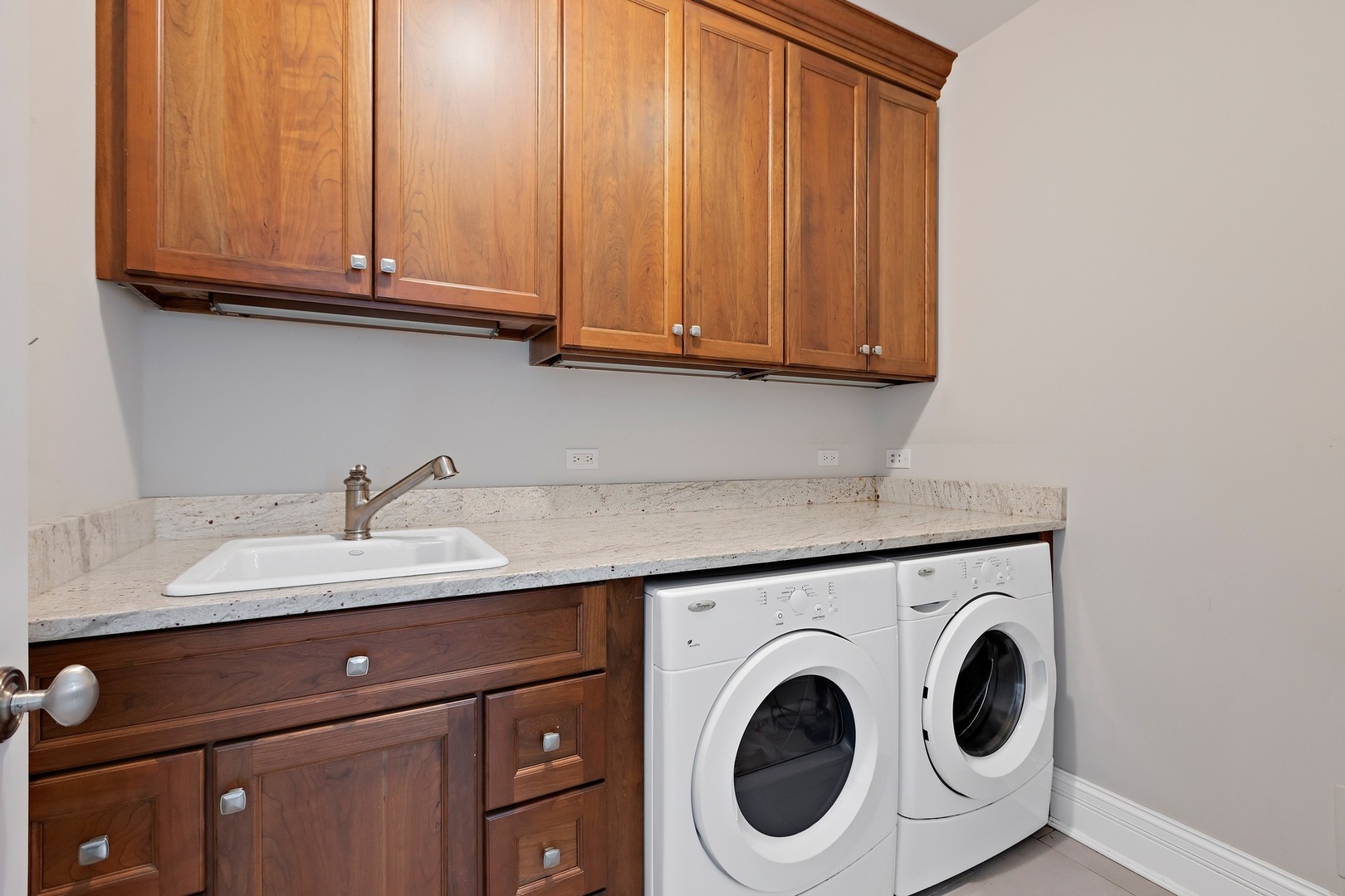 1161 Chatfield Road Winnetka, IL 60093 - Photo 19 of 42 a utility room with granite countertop cabinets washer and dryer