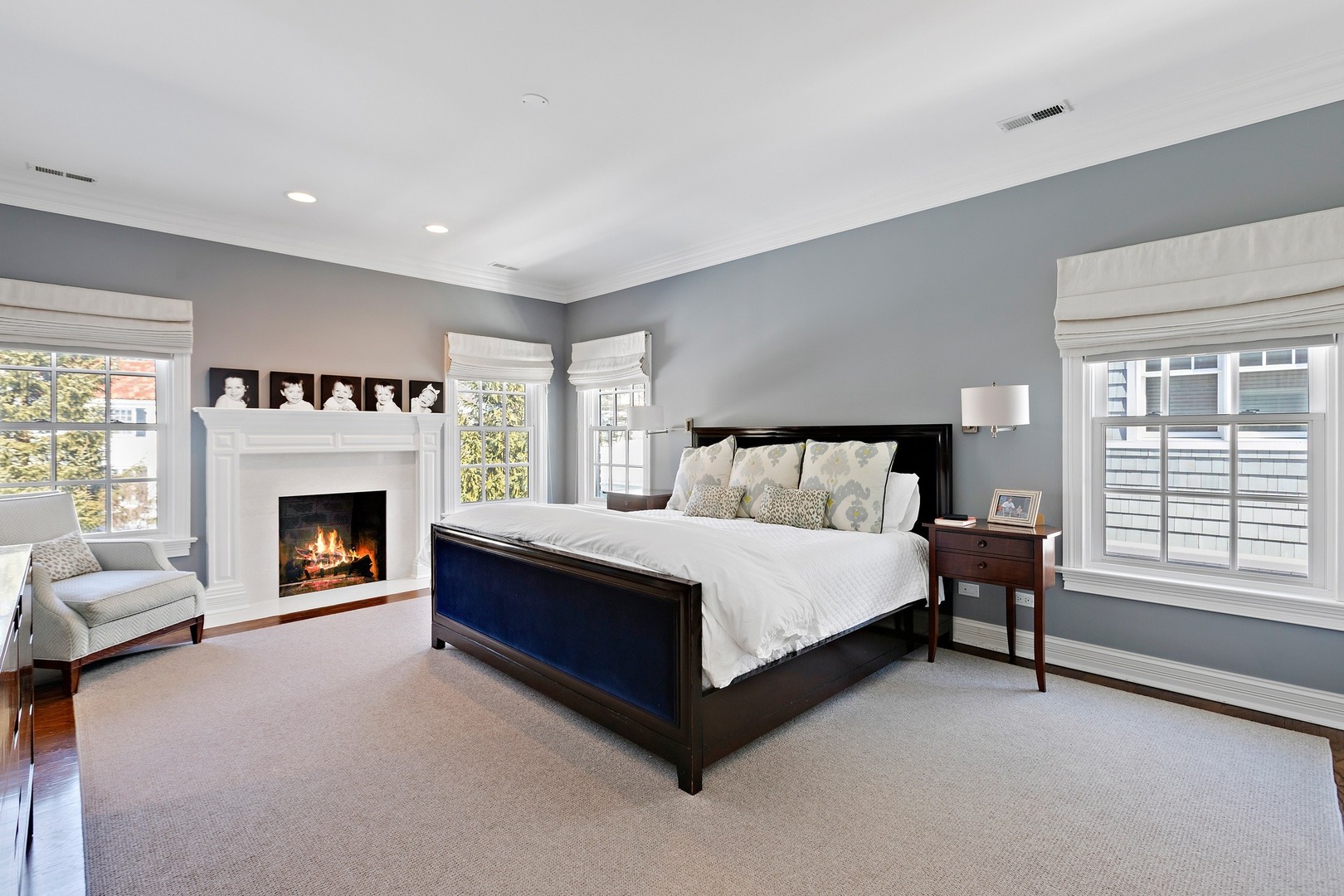 1161 Chatfield Road Winnetka, IL 60093 - Photo 21 of 42 a spacious bedroom with a bed and a fireplace
