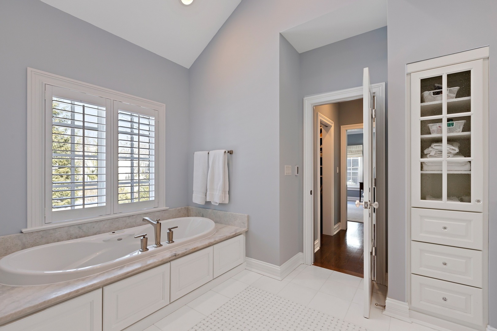1161 Chatfield Road Winnetka, IL 60093 - Photo 24 of 42 a bathroom with a tub a sink and a window
