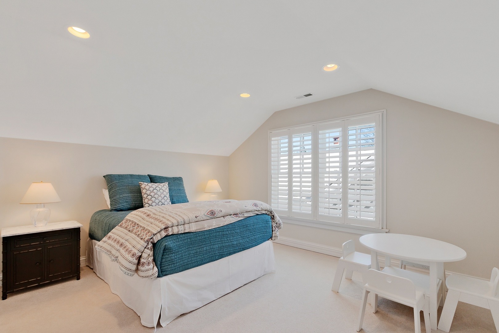 1161 Chatfield Road Winnetka, IL 60093 - Photo 31 of 42 a spacious bedroom with a bed and a chair