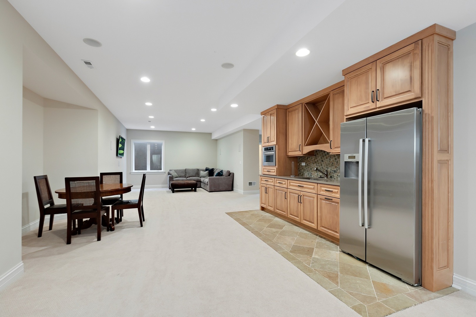 1161 Chatfield Road Winnetka, IL 60093 - Photo 35 of 42 a kitchen with stainless steel appliances kitchen island granite countertop a refrigerator and cabinets