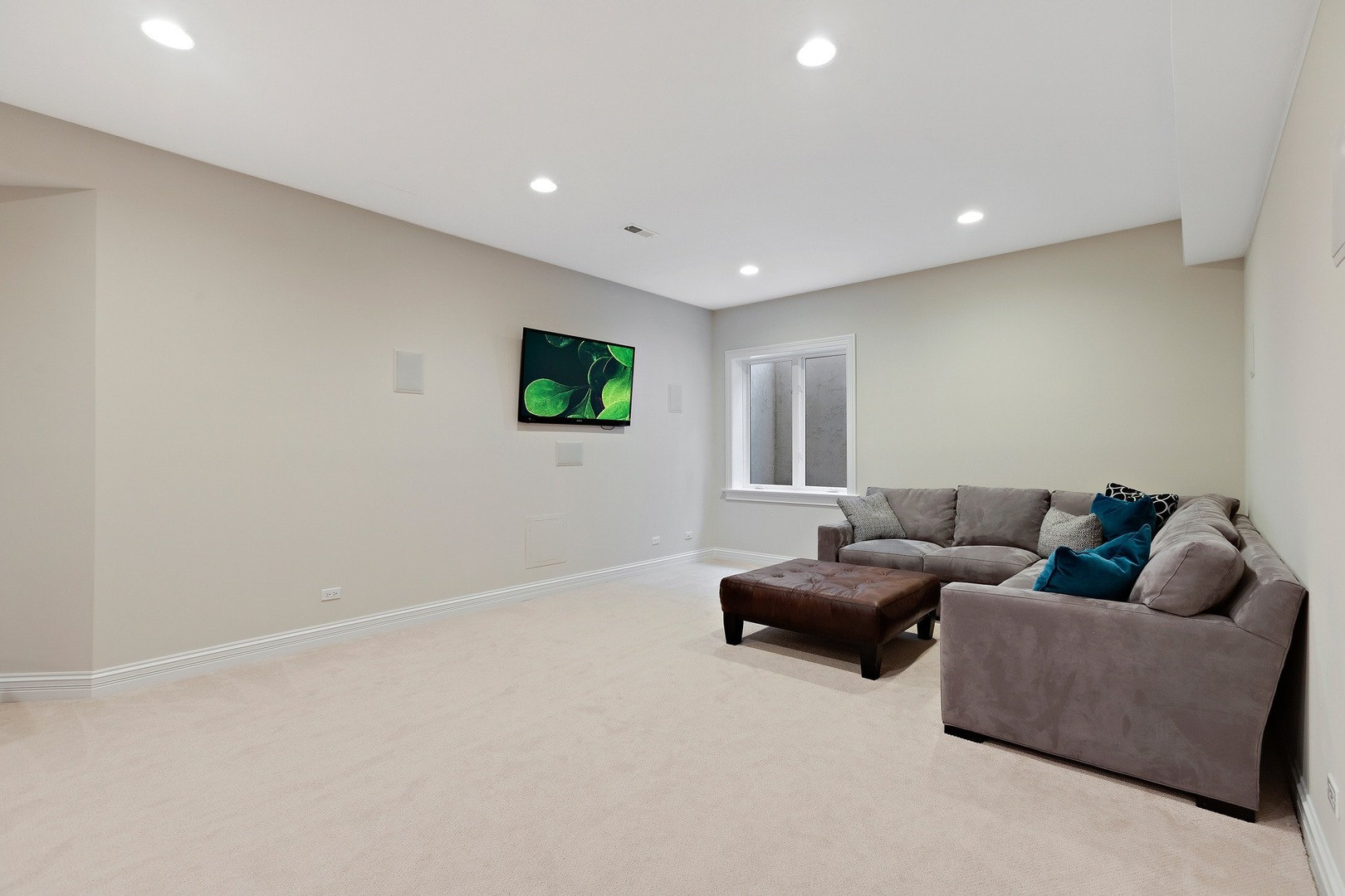 1161 Chatfield Road Winnetka, IL 60093 - Photo 37 of 42 a living room with furniture and a flat screen tv