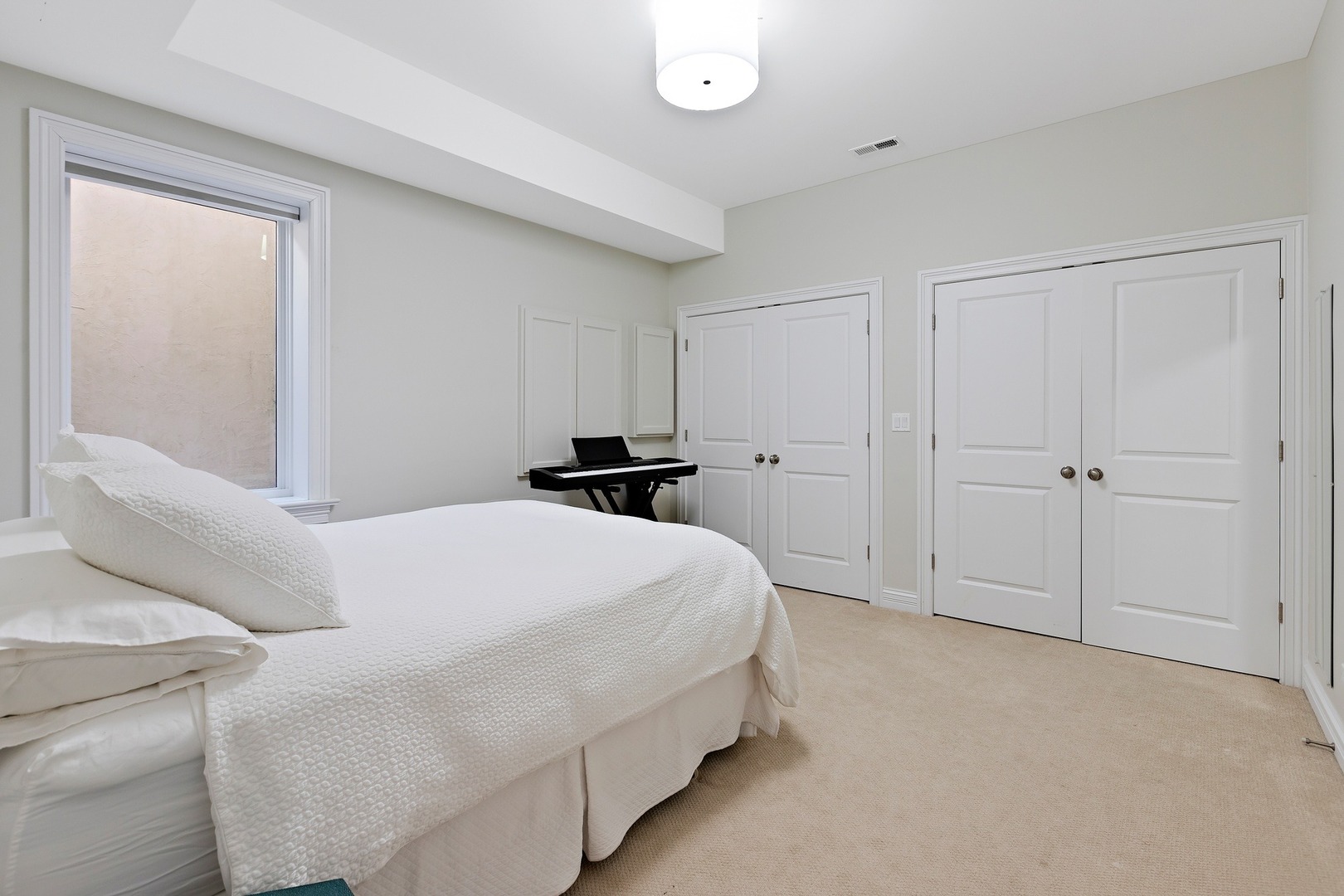 1161 Chatfield Road Winnetka, IL 60093 - Photo 38 of 42 a bedroom with a bed and a window