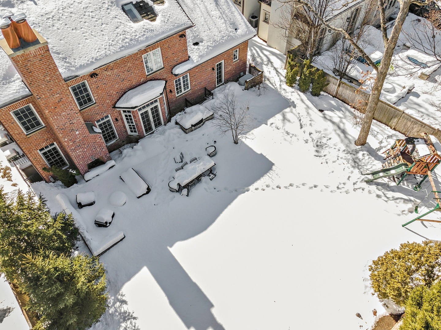 1161 Chatfield Road Winnetka, IL 60093 - Photo 41 of 42 an aerial view of a house with a yard and parking