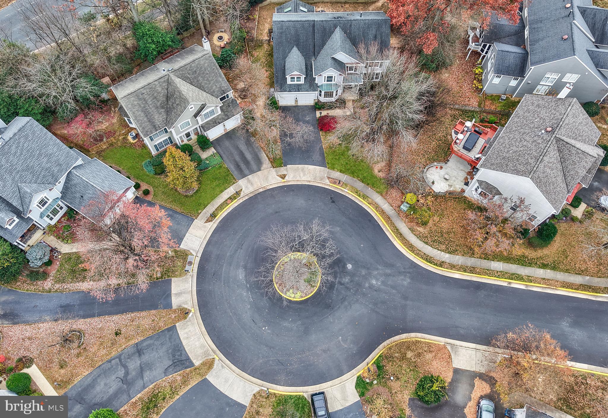 an aerial view of a house with a swimming pool