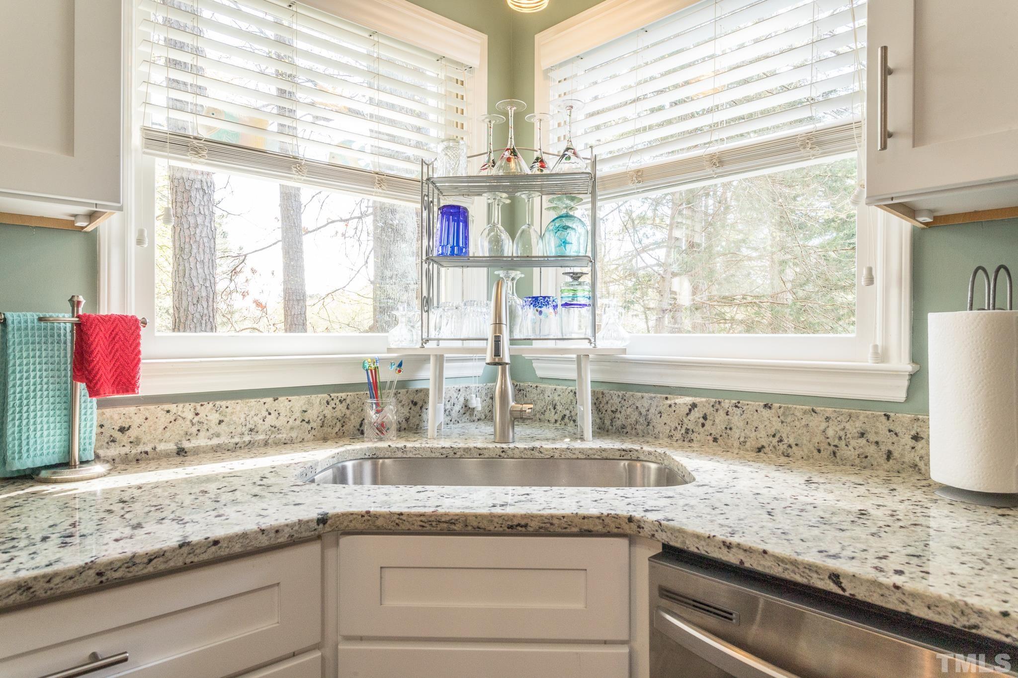 2352 Declaration Drive Raleigh, NC 27615 - Photo 11 of 28 a kitchen with granite countertop a sink and a window