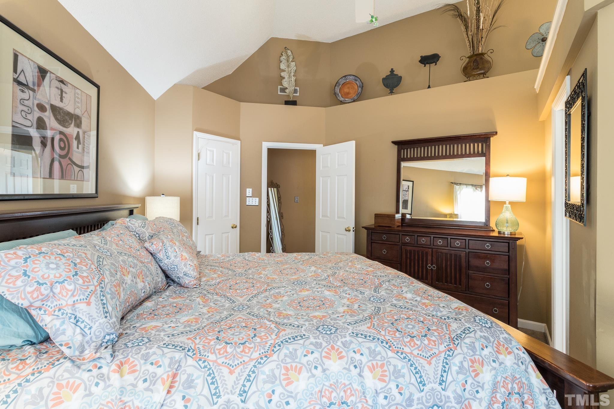 2352 Declaration Drive Raleigh, NC 27615 - Photo 17 of 28 a bedroom with a large bed and dresser