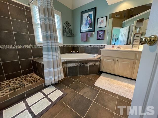 2352 Declaration Drive Raleigh, NC 27615 - Photo 19 of 28 a bathroom with a double vanity sink and a mirror