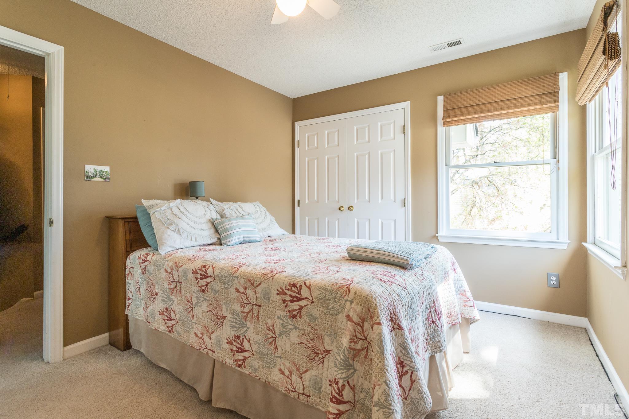 2352 Declaration Drive Raleigh, NC 27615 - Photo 21 of 28 a bed sitting in a bedroom next to a window